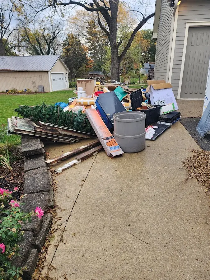 Dumpster being loaded with debris for Estate Cleanout Dumpster Rental in Jim Thorpe